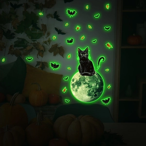 Luminous Halloween wall sticker featuring a black cat on a glowing green moon with bats