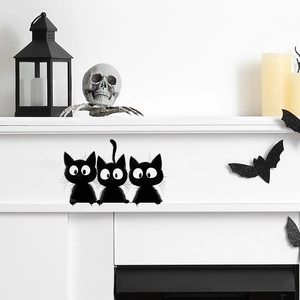 Three cute black cartoon cat wall stickers for Halloween home decor in fireplace setting