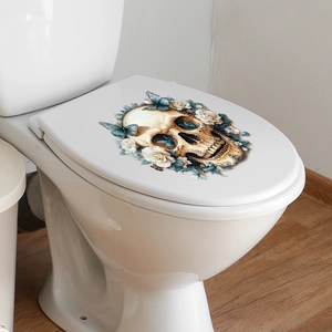 Gothic toilet lid sticker with a golden skull surrounded by white roses and blue butterflies