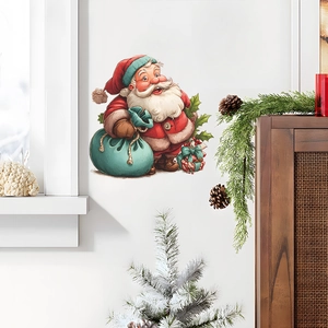 Self-adhesive Christmas Santa Claus wall decal with gift bags on a clean white wall