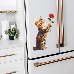 Cat with rose wall sticker on a white refrigerator in a modern kitchen setting