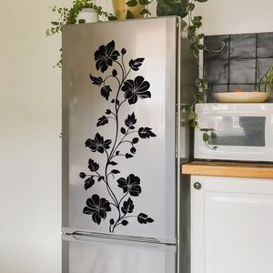 Detail of black floral vine wall stickers applied on a silver double-door refrigerator