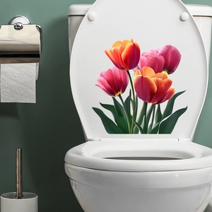 Detail of vibrant pink and orange tulip floral waterproof stickers on a white toilet lid