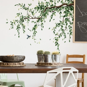 Self-adhesive wall sticker with green tree branches and blue bird for home decoration