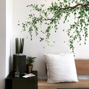 Self-adhesive wall stickers with green branches, leaves and a blue bird for home decor
