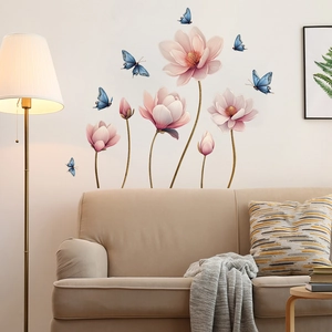 Detail of pink magnolia wall stickers and blue butterflies in a cozy living room setting