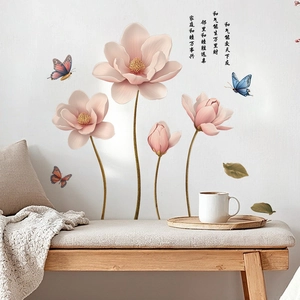 Detail of floral wall stickers with pink magnolia flowers and butterflies on a white wall