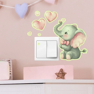 Luminous cartoon elephant and pink heart wall stickers glowing around a light switch