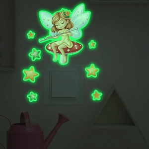 Glow-in-the-dark wall stickers featuring a fairy and stars around a light switch