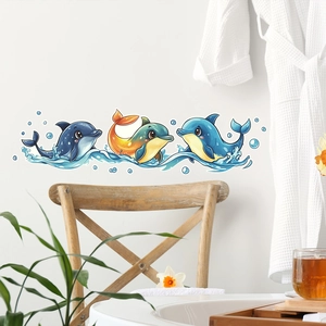 Detail showing three colorful cartoon dolphin wall stickers with water bubbles for bathroom decor