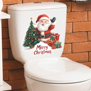Detail showing Santa Claus and Christmas tree stickers applied on a white toilet tank