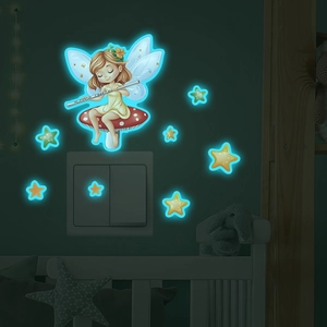 Luminous fairy on mushroom wall stickers with stars glowing in a dark bedroom