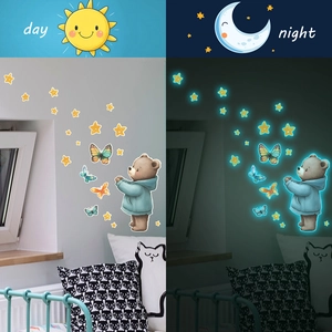 Luminous watercolor bear and butterflies wall decals shown in day and night effects