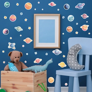 Detailed view of solar system wall stickers in a cozy children room with starry background