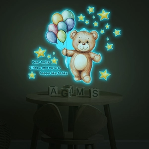 Détails d'autocollants muraux ourson et étoiles fluorescents dans le noir