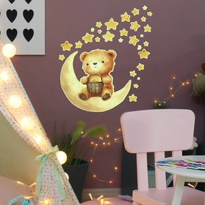 Detailed view of luminous cartoon bear on moon wall sticker in a cozy nursery bedroom