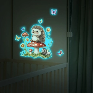Luminous wall decal showing a cartoon hedgehog and mushroom glowing in a dark nursery room
