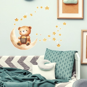 Detailed view of brown bear on moon wall sticker with stars in a cozy nursery setting