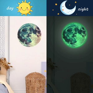 Luminous moon wall sticker showing side-by-side day and night glow effects for rooms