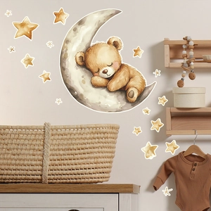 Detailed view of watercolor sleeping bear and stars wall decal in a cozy nursery room