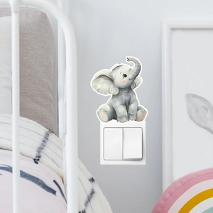 Close-up of cute watercolor elephant luminous sticker applied above a white light switch