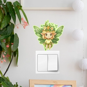 Detailed view of luminous elf wall sticker applied above a light switch on a white wall