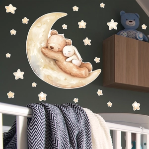Luminous moon wall sticker with sleeping bear and bunny in a cozy nursery setting