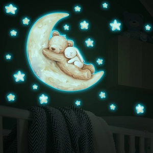 Glow-in-the-dark bear and bunny on a moon wall sticker for a peaceful nursery bedroom decor