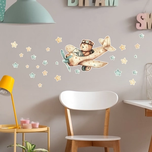 Kinderzimmer Wandtattoo mit Bär im Flugzeug und dekorativen Sternen im Aquarellstil