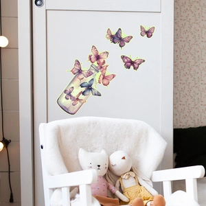 Luminous wall stickers featuring purple butterflies flying out of a decorative glass jar