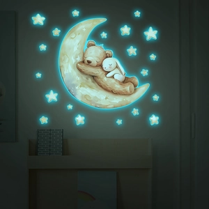 Luminous wall sticker featuring cartoon bear and rabbit sleeping on a crescent moon with stars