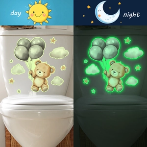 Luminous cartoon bear and clouds wall decals showing day and night glow effects