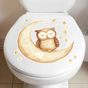Luminous cartoon owl and moon decorative self-adhesive sticker on a white toilet lid