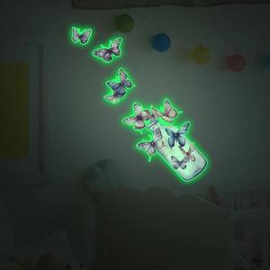 Luminous wall stickers featuring glass bottle and purple butterflies with green glow