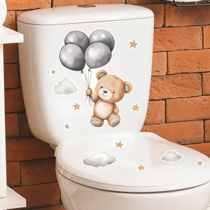 Glow-in-the-dark toilet stickers with cartoon bear holding balloons and stars