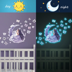 Luminous wall stickers featuring a girl on the moon and a wolf with blue night glow