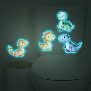 Glow-in-the-dark cartoon dinosaur wall stickers shown glowing in a dark bathroom setting