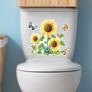 Detailed view of luminous sunflower and butterfly stickers on a white toilet tank