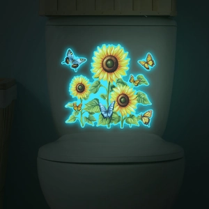 Luminous wall sticker showing glowing blue sunflowers and butterflies in dark bathroom