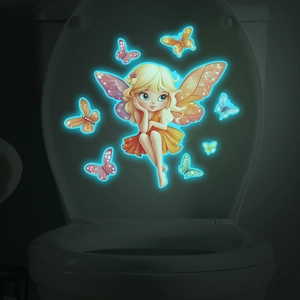 Luminous cartoon fairy and butterfly stickers glowing on a bathroom toilet lid in the dark