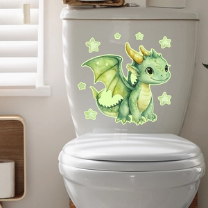 Close-up of cute green baby dragon and stars stickers on a white toilet tank surface