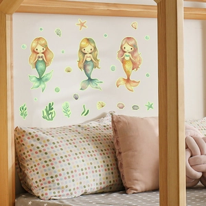 Luminous cartoon mermaid wall stickers set showing glow-in-the-dark effects in a nursery