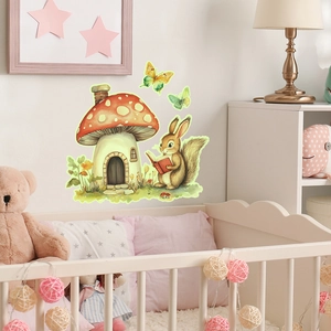 Watercolor mushroom house and squirrel wall stickers displayed over a white nursery crib