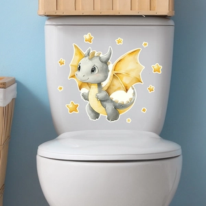 Detail of cute dinosaur and stars luminous sticker applied to a white toilet tank surface