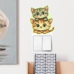 Luminous cat switch sticker featuring stacked cartoon kittens for wall and home decor