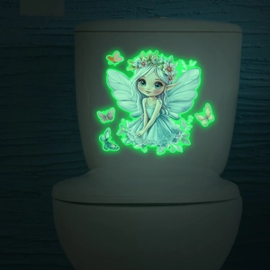 Luminous princess fairy and butterfly stickers glowing green on a white toilet tank