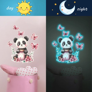 Luminous panda and butterfly wall sticker showing day and night glow effect on pink wall