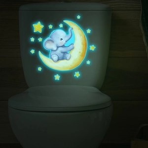 Luminous wall sticker featuring a cute cartoon elephant on moon with glowing stars