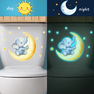 Luminous cartoon elephant and moon wall stickers showing day and night glow effects