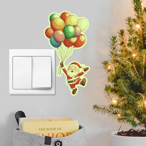 Luminous Santa Claus wall sticker with colorful balloons next to a light switch